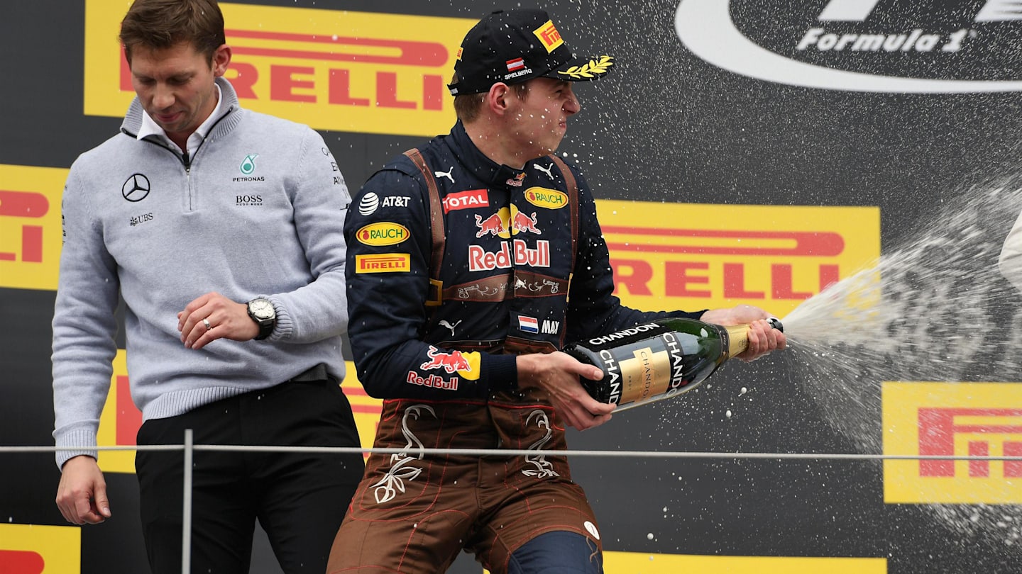 Max Verstappen (NED) Red Bull Racing celebrates on the podium with the champagne at Formula One