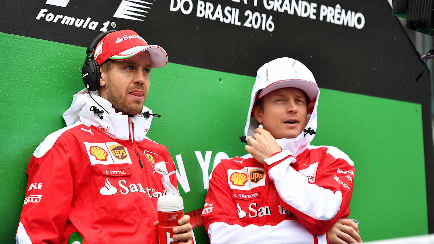 Sebastian Vettel (GER) Ferrari and Kimi Raikkonen (FIN) Ferrari on the drivers parade at Formula