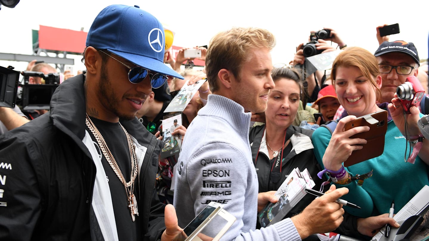 Lewis Hamilton (GBR) Mercedes AMG F1 and Nico Rosberg (GER) Mercedes AMG F1 at the fans autograph