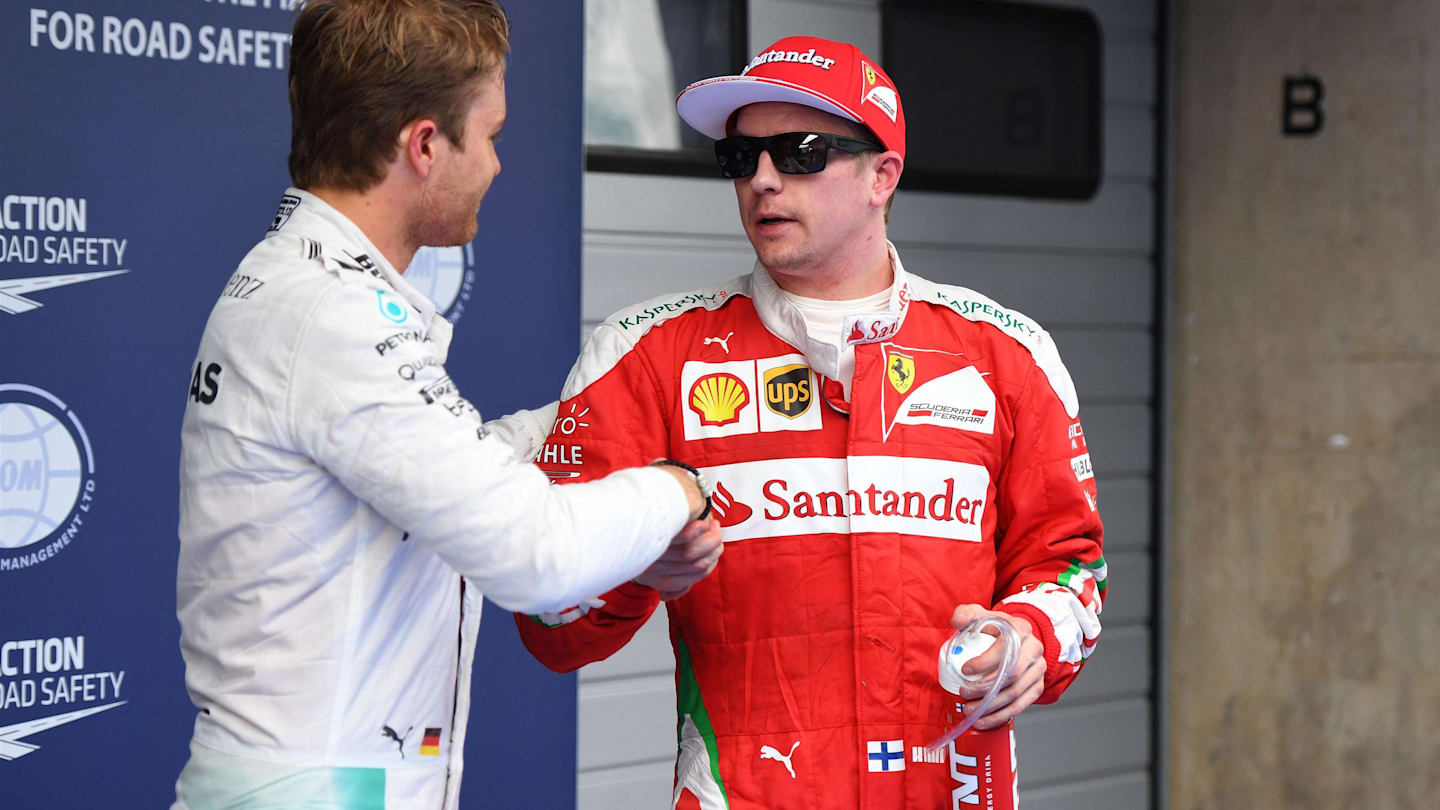 Pole sitter Nico Rosberg (GER) Mercedes AMG F1 and Kimi Raikkonen (FIN) Ferrari celebrate in parc