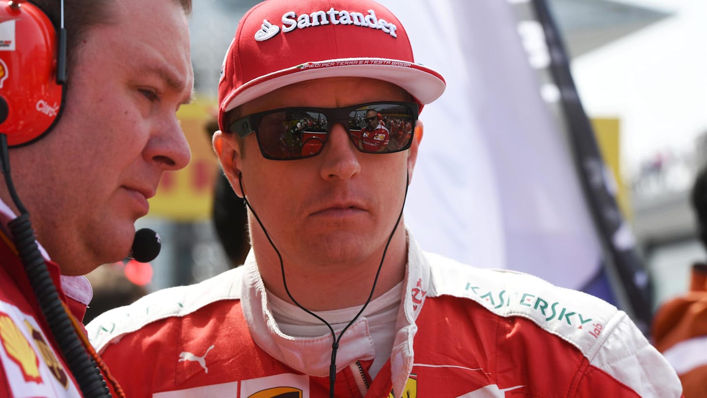 Dave Greenwood Ferrari Race Engineer and Kimi Raikkonen (FIN) Ferrari on the grid at Formula One