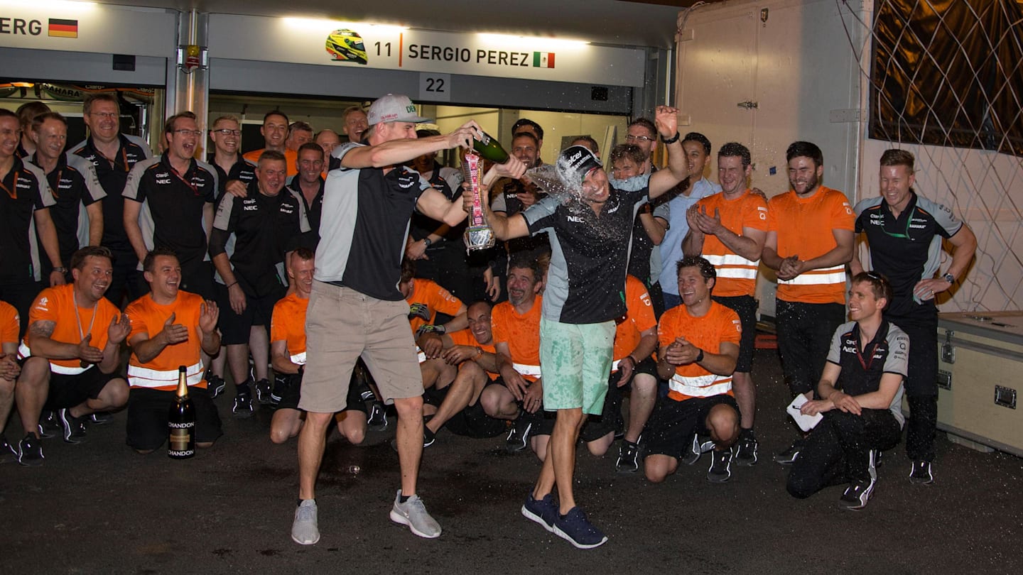 Nico Hulkenberg (GER) Force India F1 and Sergio Perez (MEX) Force India celebrate with the team and