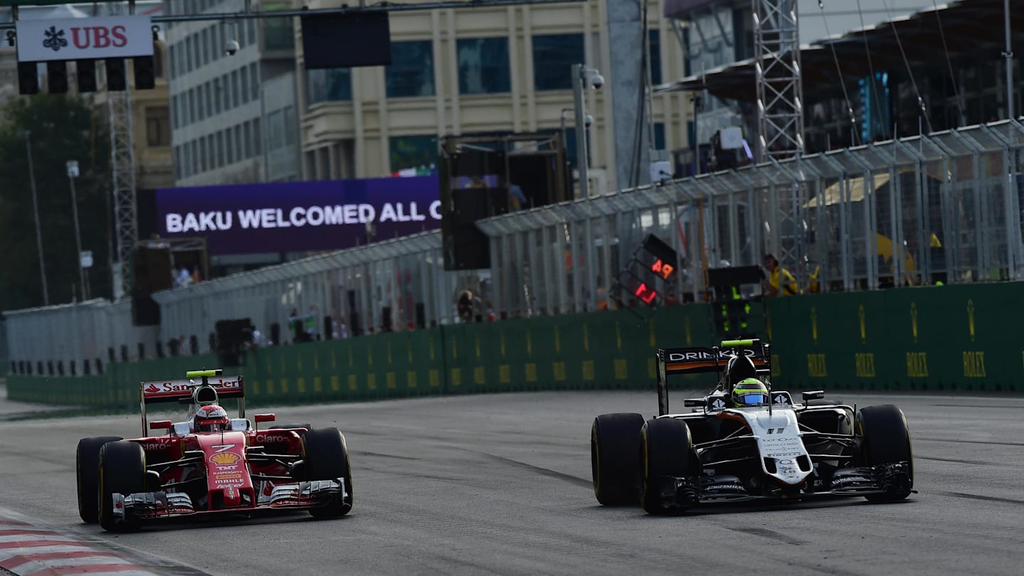 Kimi Raikkonen (FIN) Ferrari SF16-H and Sergio Perez (MEX) Force India VJM09 at Formula One World