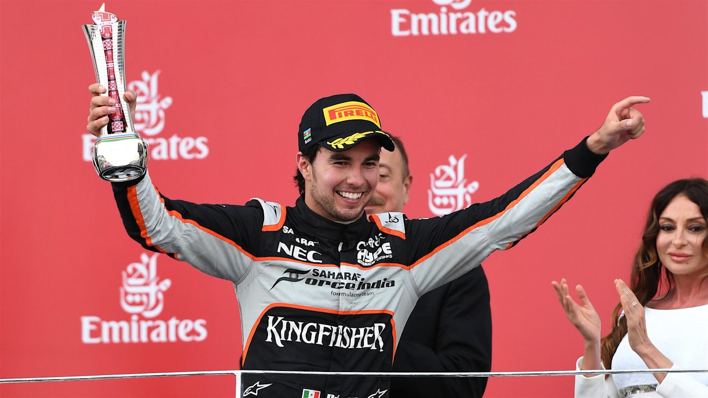 Sergio Perez (MEX) Force India celebrates on the podium with the trophy at Formula One World