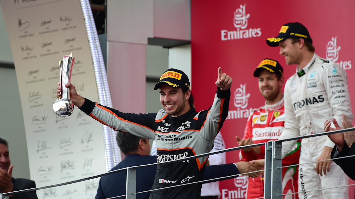 Sergio Perez (MEX) Force India celebrates on the podium with the trophy at Formula One World