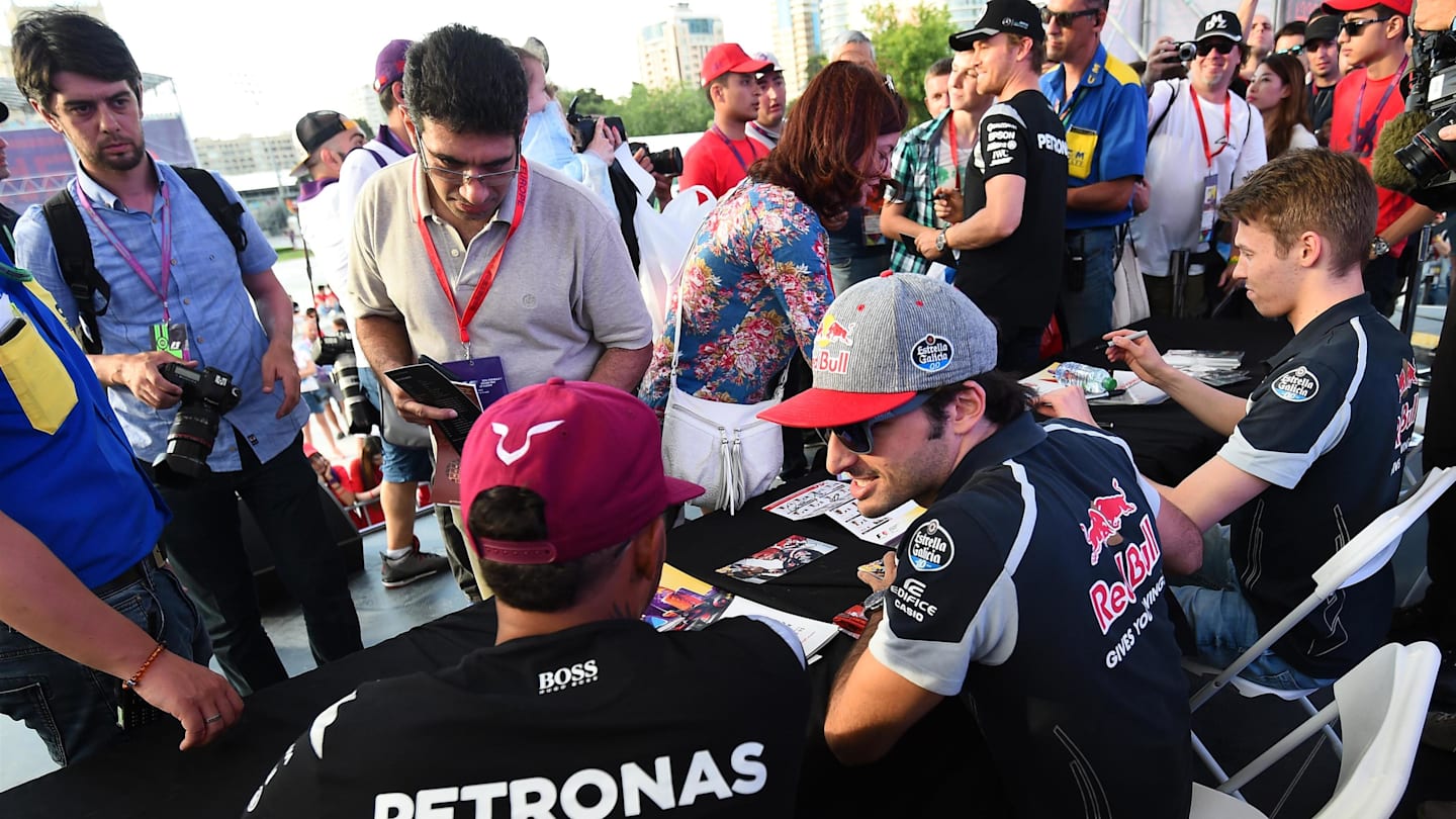 Lewis Hamilton (GBR) Mercedes AMG F1 and Carlos Sainz (ESP) Scuderia Toro Rosso meet the fans at the autograph session at Formula One World Championship, Rd8, European Grand Prix, Preparations, Baku City Circuit, Baku, Azerbaijan, Thursday 16 June 2016. © Sutton Images