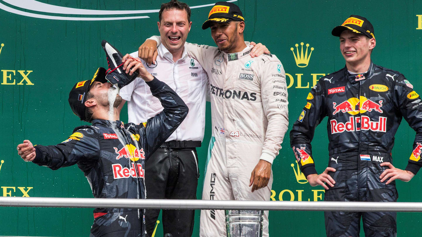 Lewis Hamilton (GBR) Mercedes AMG F1 and Max Verstappen (NED) Red Bull Racing celebrate on the podium with the champagne as Daniel Ricciardo (AUS) Red Bull Racing drinks champagne from his race boot at Formula One World Championship, Rd12, German Grand Prix, Race, Hockenheim, Germany, Sunday 31 July 2016. © Sutton Images