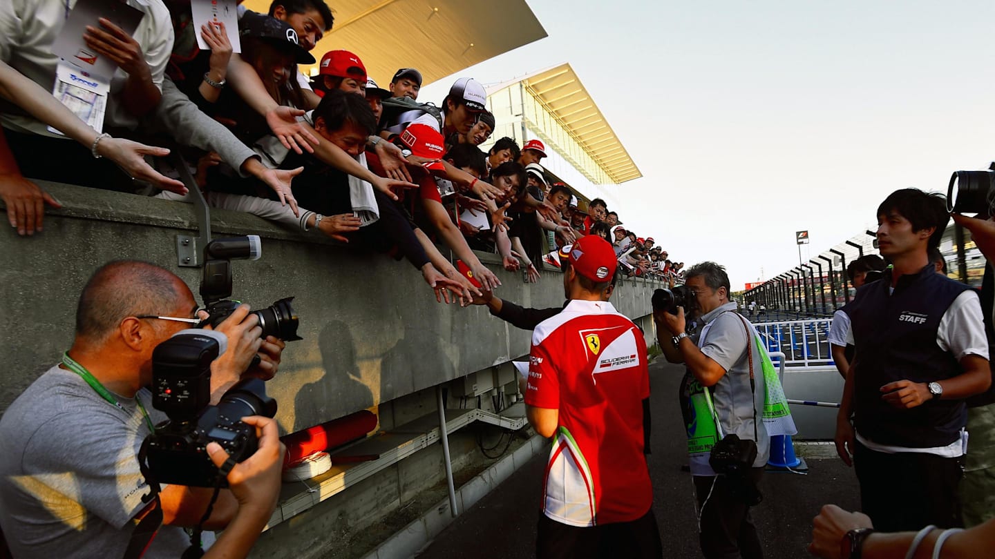 Sebastian Vettel (GER) Ferrari signs autographs for the fans at Formula One World Championship,