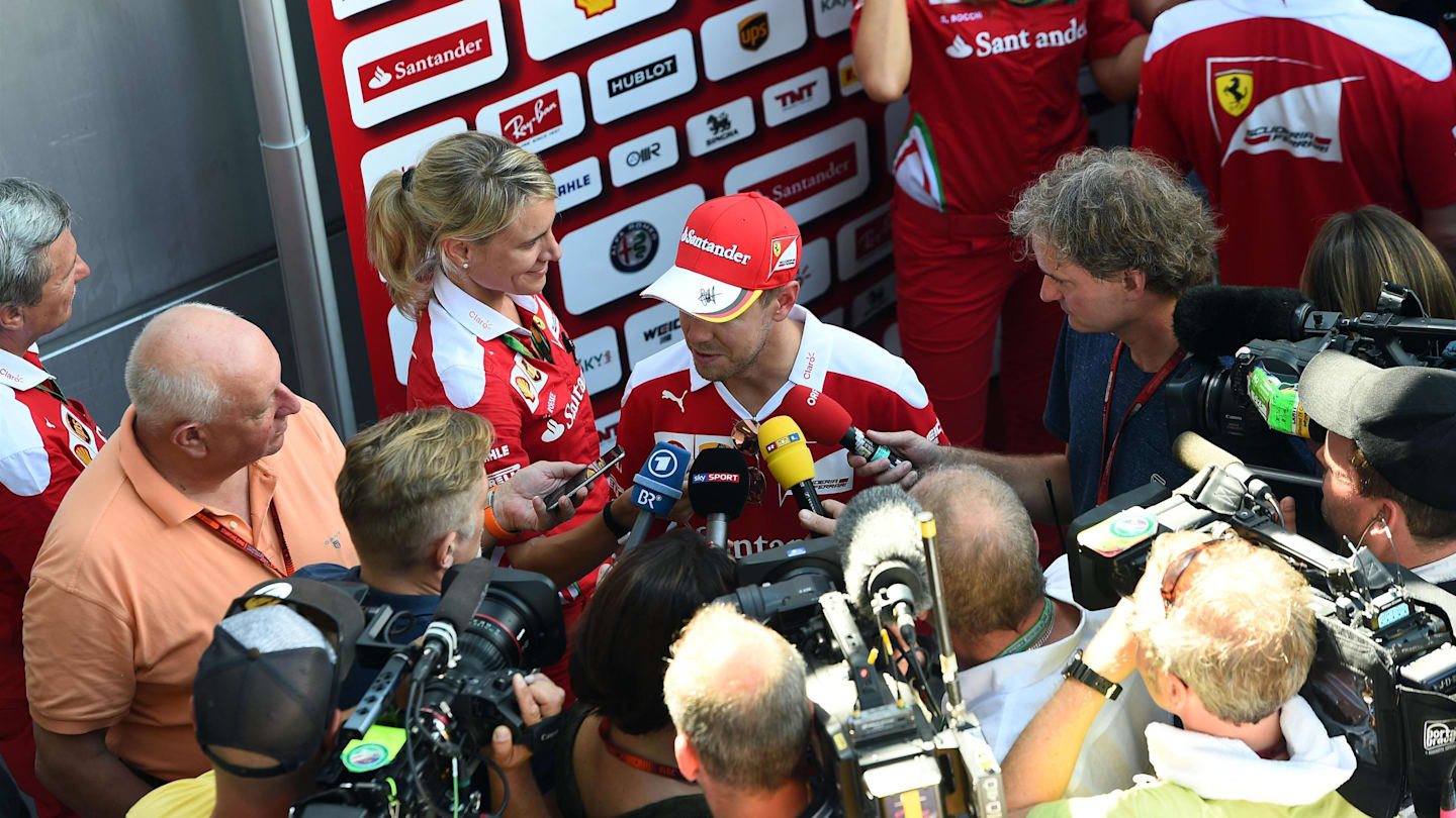 Sebastian Vettel (GER) Ferrari talks to the media at Formula One World Championship, Rd16,