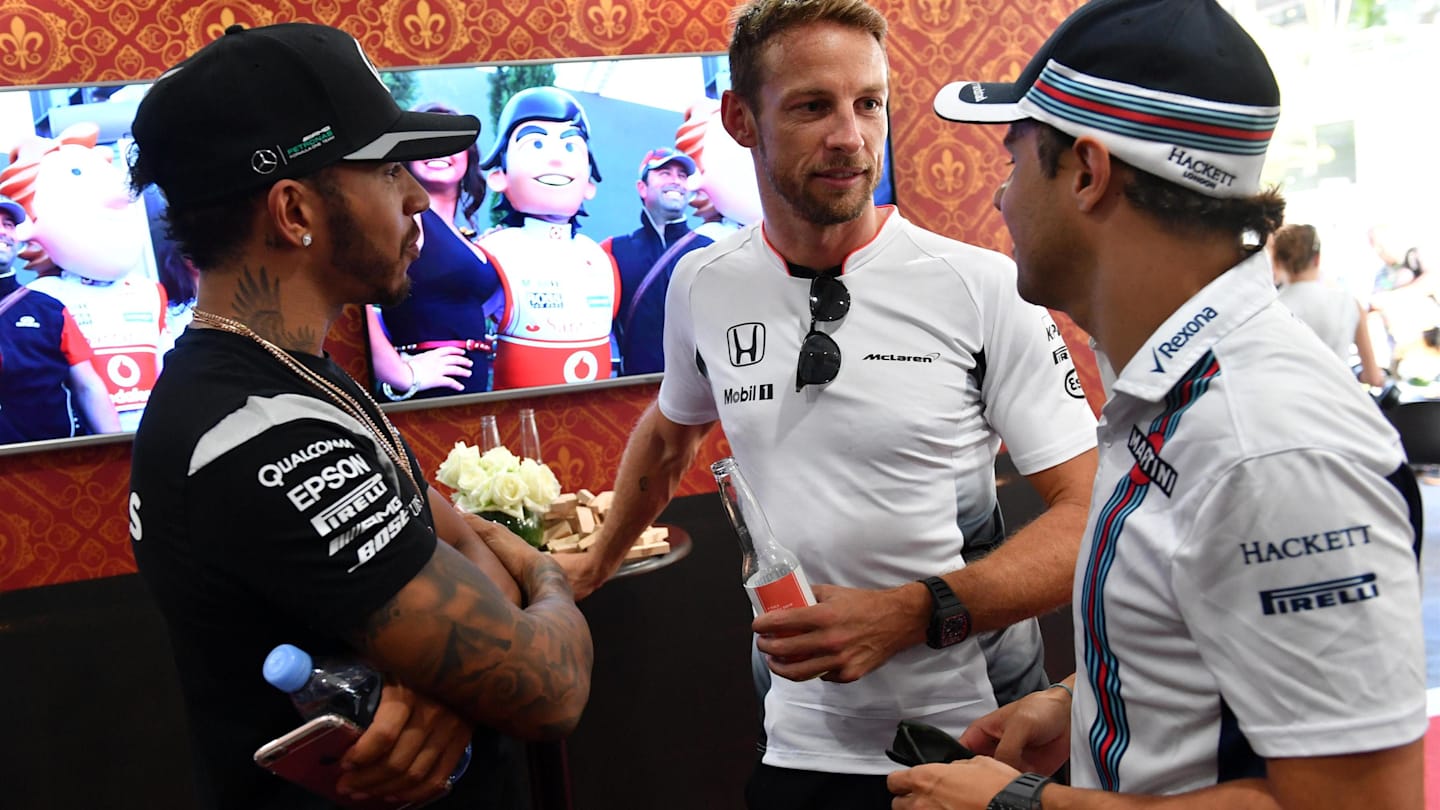 Jenson Button (GBR) McLaren celebrates his 300th Grand Prix with Lewis Hamilton (GBR) Mercedes AMG F1 and Felipe Massa (BRA) Williams  at Formula One World Championship, Rd16, Malaysian Grand Prix, Practice, Sepang, Malaysia, Friday 30 September 2016. © Sutton Images