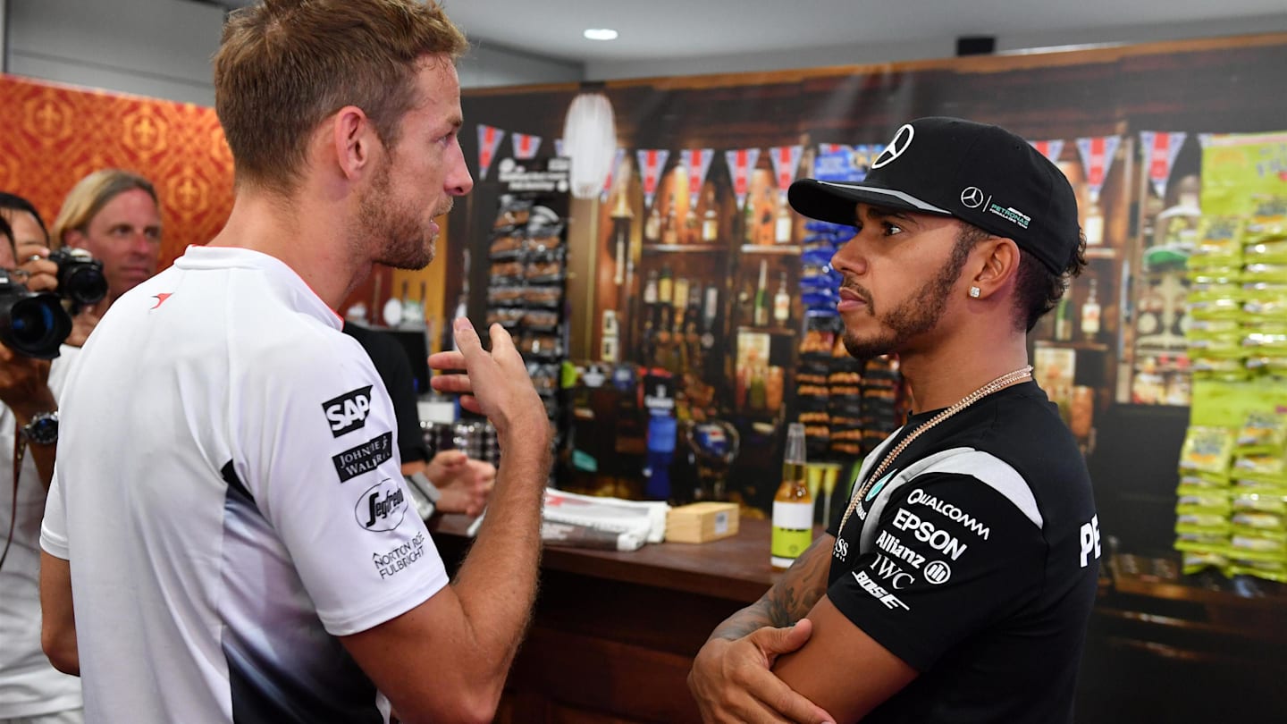 Jenson Button (GBR) McLaren celebrates his 300th Grand Prix with Lewis Hamilton (GBR) Mercedes AMG F1 at Formula One World Championship, Rd16, Malaysian Grand Prix, Practice, Sepang, Malaysia, Friday 30 September 2016. © Sutton Images