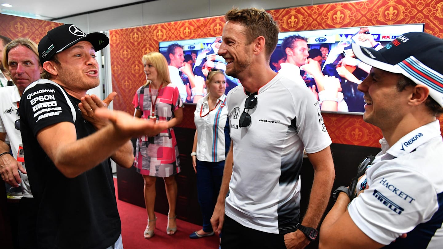 Jenson Button (GBR) McLaren celebrates his 300th Grand Prix with Nico Rosberg (GER) Mercedes AMG F1 and Felipe Massa (BRA) Williams at Formula One World Championship, Rd16, Malaysian Grand Prix, Practice, Sepang, Malaysia, Friday 30 September 2016. © Sutton Images