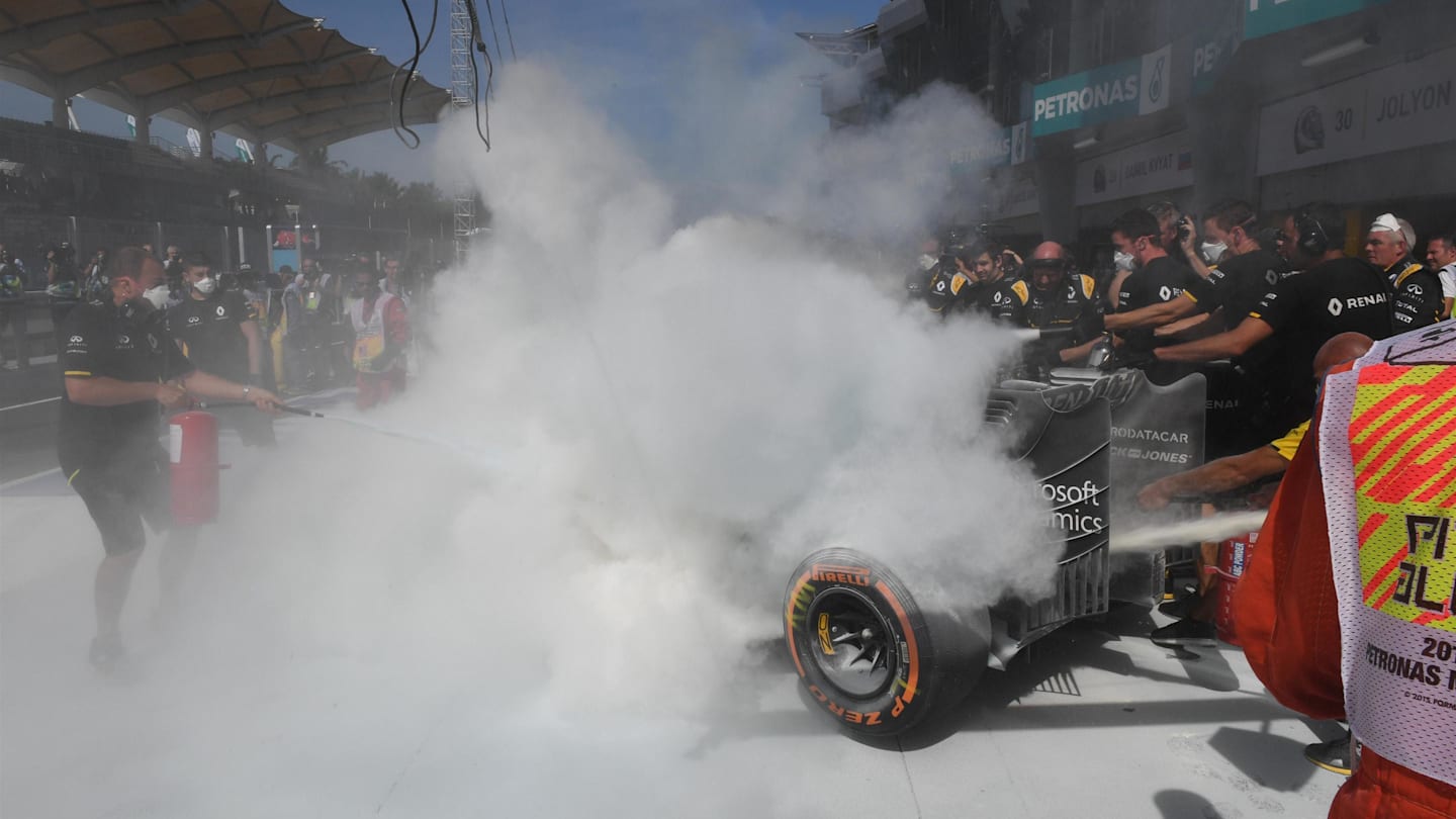 The burning car of Kevin Magnussen (DEN) Renault Sport F1 Team RS16 in pit lane during FP1 at Formula One World Championship, Rd16, Malaysian Grand Prix, Practice, Sepang, Malaysia, Friday 30 September 2016. © Sutton Images