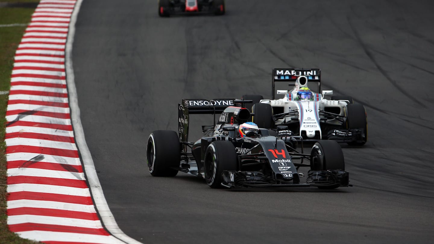 Fernando Alonso (ESP) McLaren MP4-31 and Felipe Massa (BRA) Williams FW38 at Formula One World Championship, Rd16, Malaysian Grand Prix, Qualifying, Sepang, Malaysia, Saturday 1 October 2016. © Sutton Images