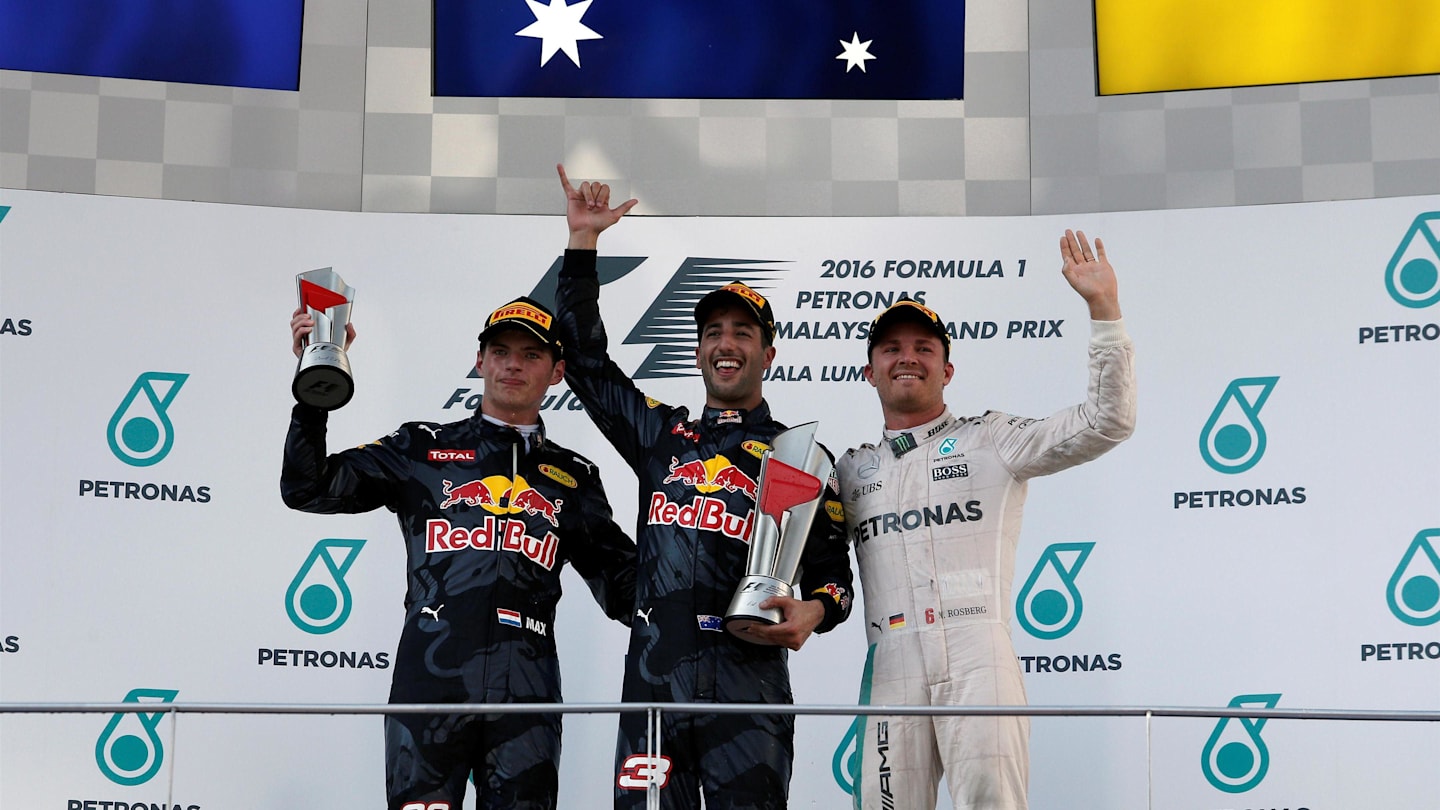 Race winner Daniel Ricciardo (AUS) Red Bull Racing celebrates on the podium with the trophy alongside second placed Max Verstappen (NED) Red Bull Racing and third placed Nico Rosberg (GER) Mercedes AMG F1 at Formula One World Championship, Rd16, Malaysian Grand Prix, Race,  Sepang, Malaysia, Sunday 2 October 2016. © Sutton Images