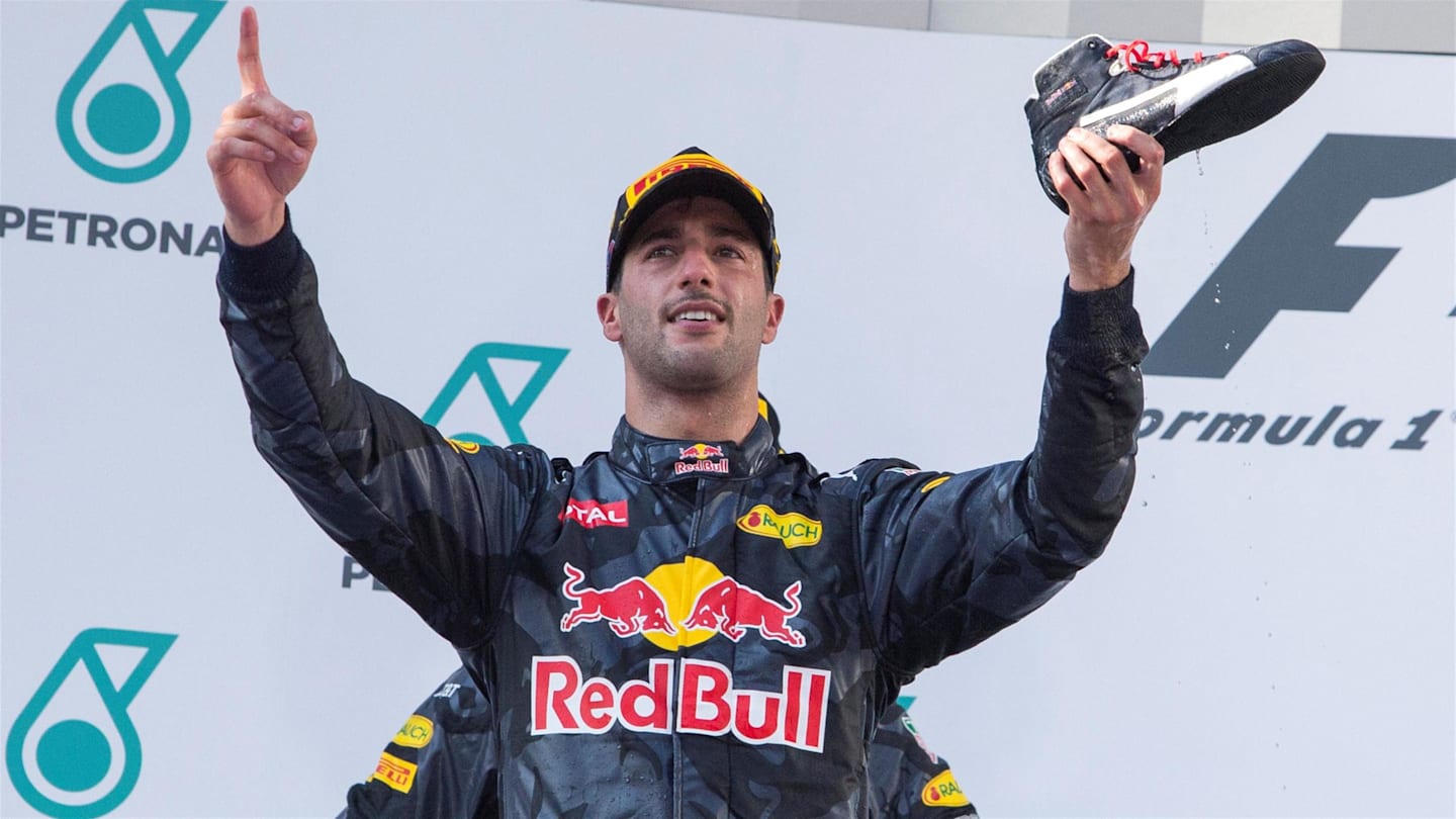 Race winner Daniel Ricciardo (AUS) Red Bull Racing celebrates  and drinks champagne from his race boot on the podium at Formula One World Championship, Rd16, Malaysian Grand Prix, Race,  Sepang, Malaysia, Sunday 2 October 2016. © Sutton Images