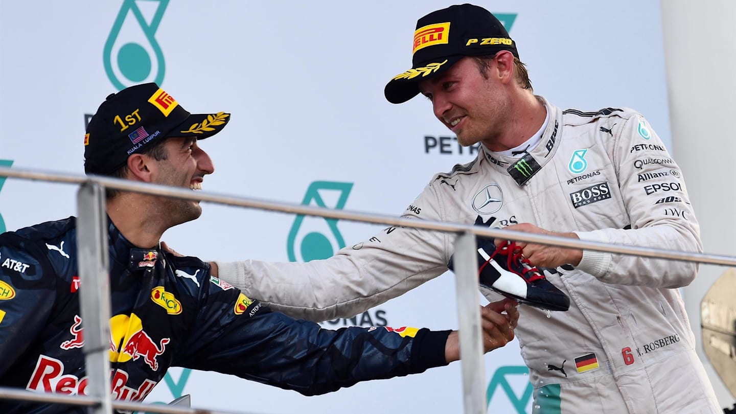 Race winner Daniel Ricciardo (AUS) Red Bull Racing and Nico Rosberg (GER) Mercedes AMG F1 celebrate on the podium at Formula One World Championship, Rd16, Malaysian Grand Prix, Race,  Sepang, Malaysia, Sunday 2 October 2016. © Sutton Images