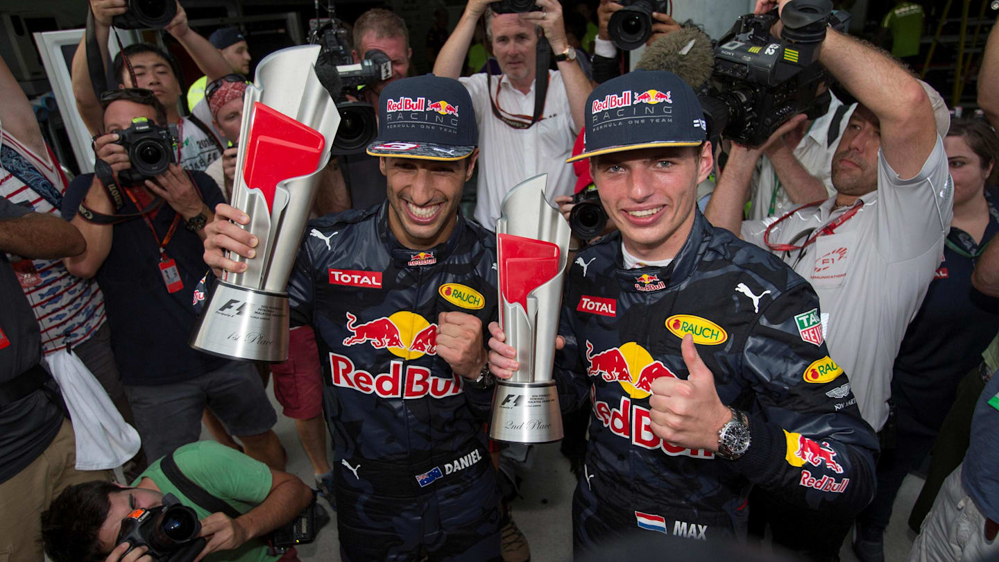 Race winner Daniel Ricciardo (AUS) Red Bull Racing and Max Verstappen (NED) Red Bull Racing celebrate with the trophies at Formula One World Championship, Rd16, Malaysian Grand Prix, Race, Sepang, Malaysia, Sunday 2 October 2016. © Sutton Images