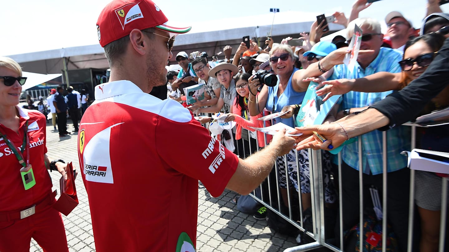 Sebastian Vettel (GER) Ferrari signs autographs for the fans at Formula One World Championship, Rd16, Malaysian Grand Prix, Race, Sepang, Malaysia, Sunday 2 October 2016. © Sutton Images