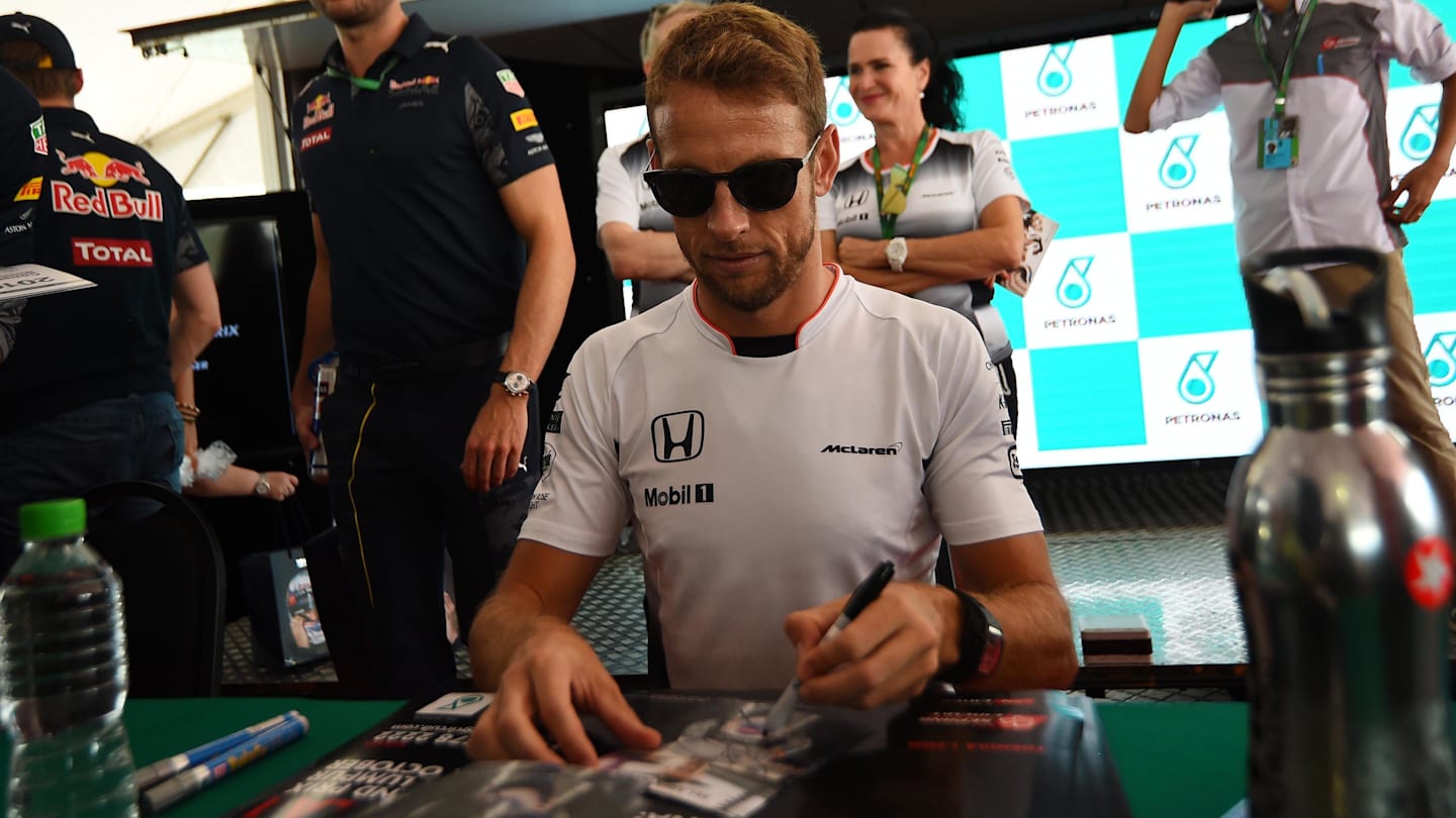 Jenson Button (GBR) McLaren signs autographs for the fans at Formula One World Championship, Rd16, Malaysian Grand Prix, Race, Sepang, Malaysia, Sunday 2 October 2016. © Sutton Images