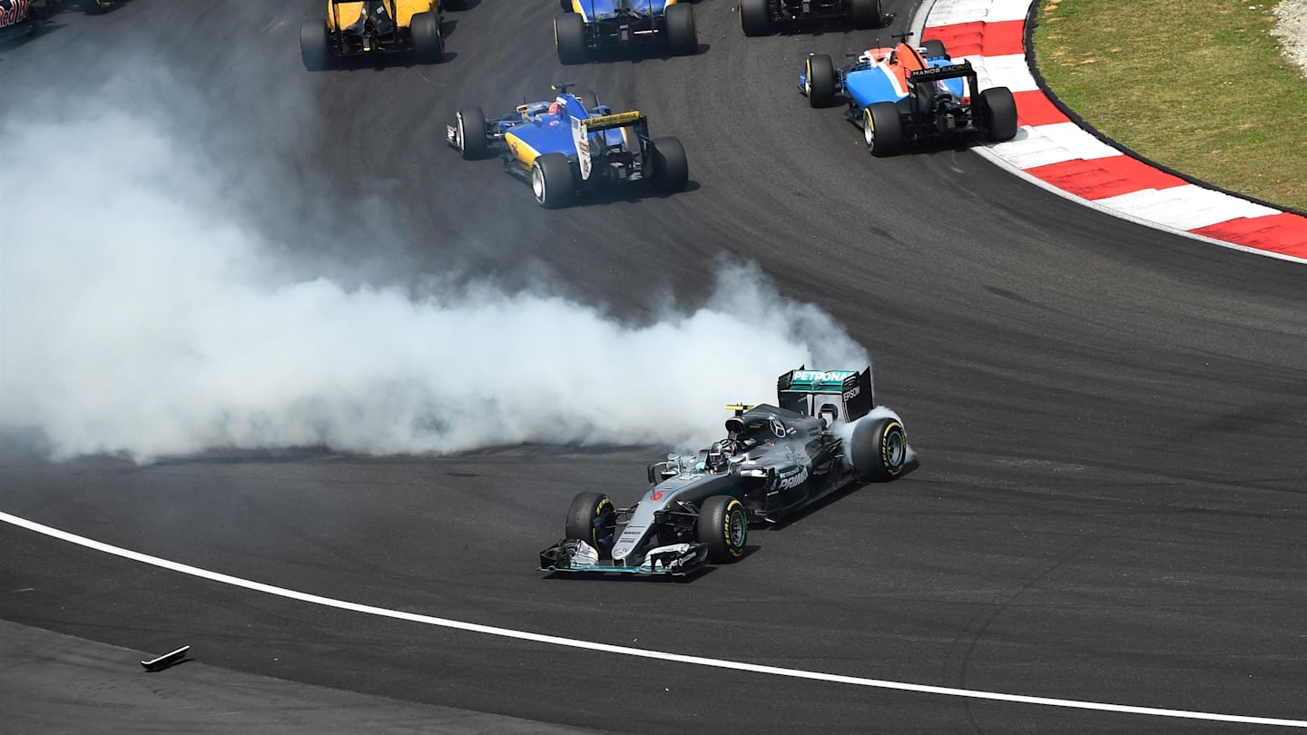 Nico Rosberg (GER) Mercedes-Benz F1 W07 Hybrid spins after contact at the start of the race at Formula One World Championship, Rd16, Malaysian Grand Prix, Race,  Sepang, Malaysia, Sunday 2 October 2016. © Sutton Images