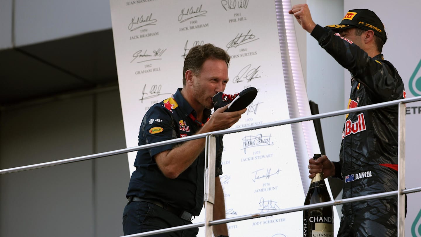 Christian Horner (GBR) Red Bull Racing Team Principal and race winner Daniel Ricciardo (AUS) Red Bull Racing celebrate on the podium and drink champagne from a shoe at Formula One World Championship, Rd16, Malaysian Grand Prix, Race,  Sepang, Malaysia, Sunday 2 October 2016. © Sutton Images