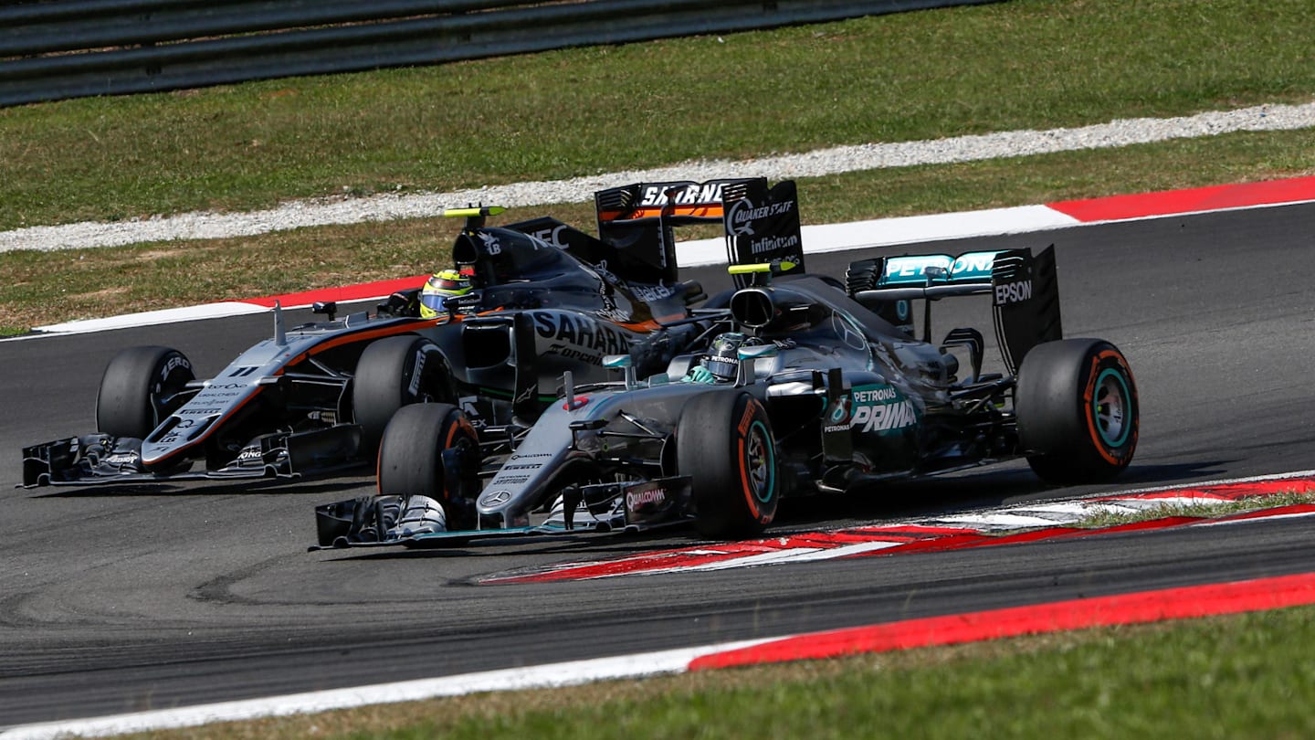 Nico Rosberg (GER) Mercedes-Benz F1 W07 Hybrid and Sergio Perez (MEX) Force India VJM09 battle at Formula One World Championship, Rd16, Malaysian Grand Prix, Race,  Sepang, Malaysia, Sunday 2 October 2016. © Sutton Images