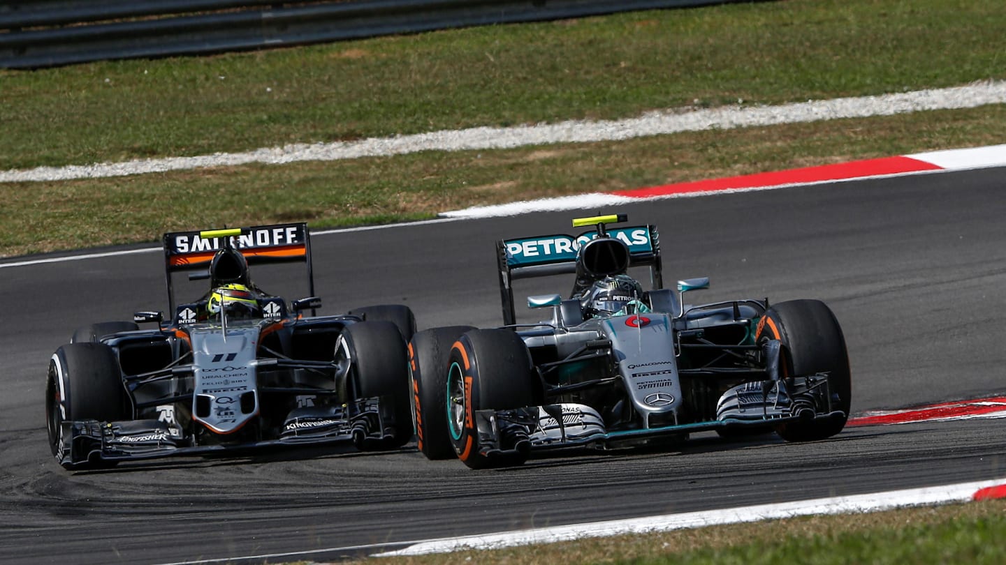 Nico Rosberg (GER) Mercedes-Benz F1 W07 Hybrid and Sergio Perez (MEX) Force India VJM09 battle at Formula One World Championship, Rd16, Malaysian Grand Prix, Race,  Sepang, Malaysia, Sunday 2 October 2016. © Sutton Images