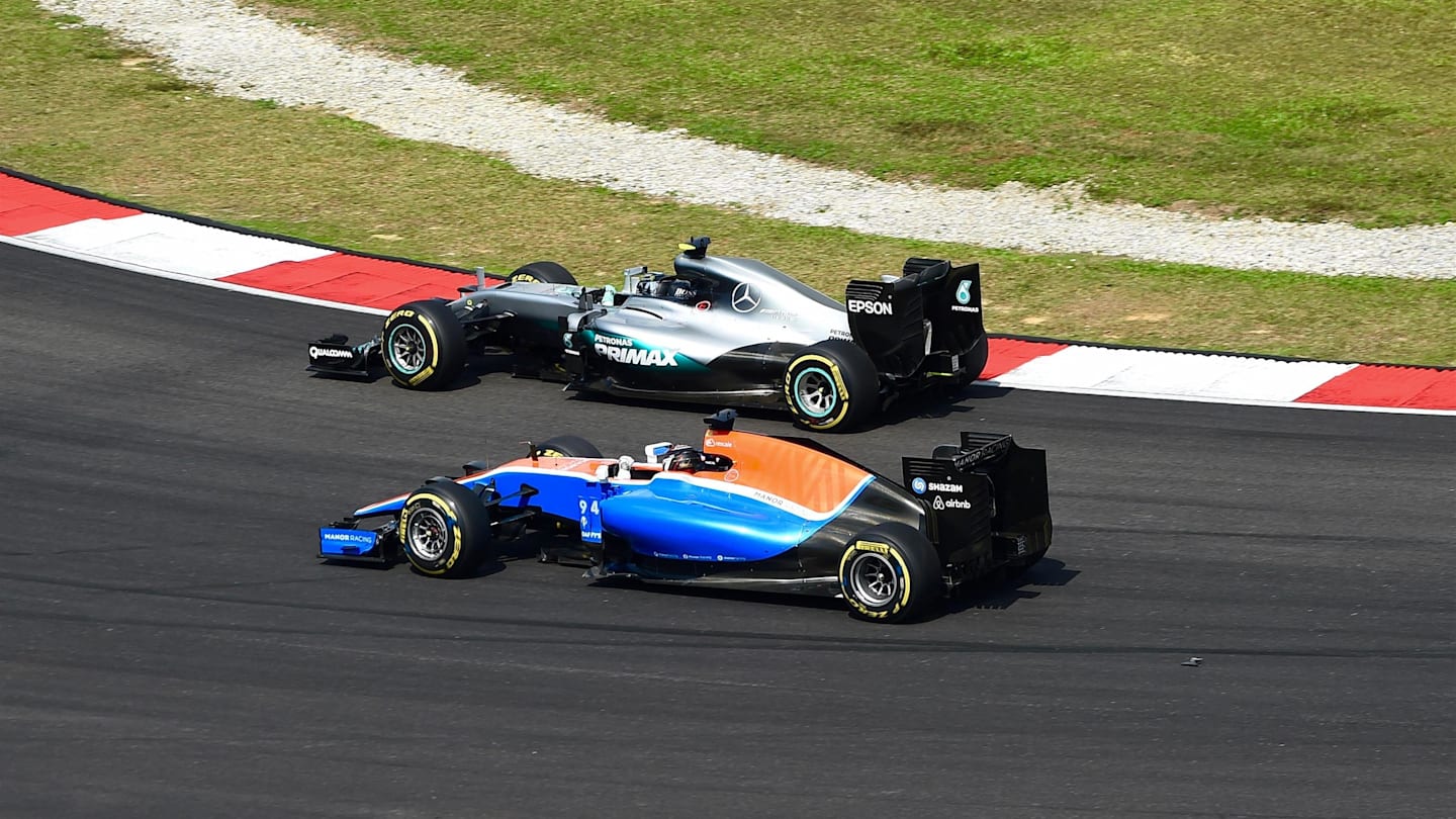 Nico Rosberg (GER) Mercedes-Benz F1 W07 Hybrid and Pascal Wehrlein (GER) Manor Racing MRT05 battle at Formula One World Championship, Rd16, Malaysian Grand Prix, Race,  Sepang, Malaysia, Sunday 2 October 2016. © Sutton Images