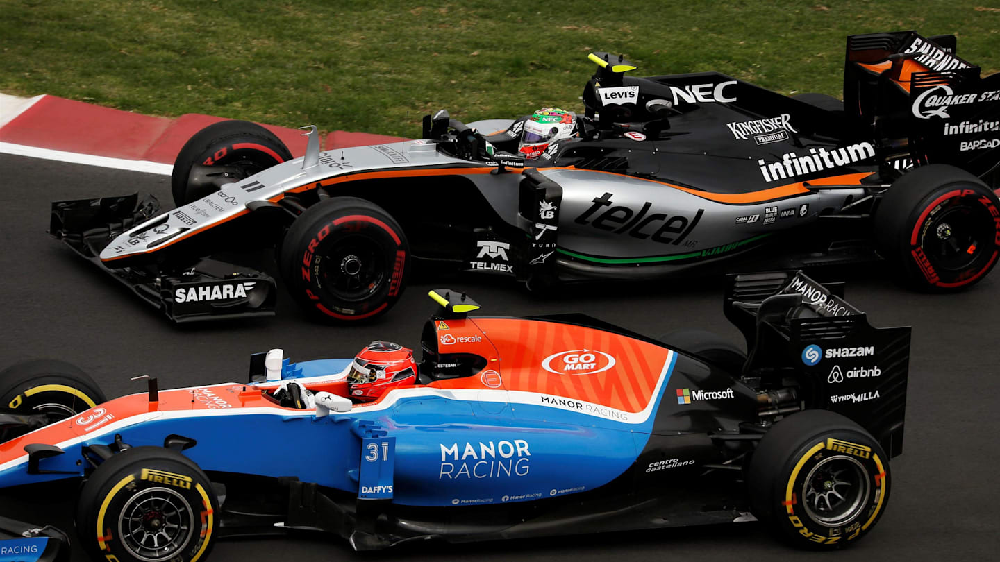 Esteban Ocon (FRA) Manor Racing MRT05 and Sergio Perez (MEX) Force India VJM09 at Formula One World