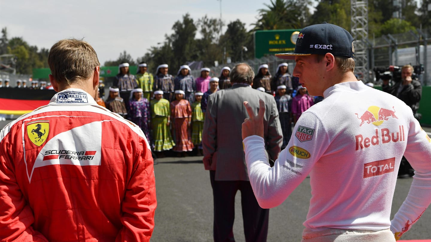 Sebastian Vettel (GER) Ferrari and Max Verstappen (NED) Red Bull Racing on the grid at Formula One