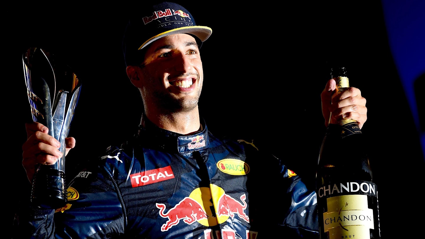 Daniel Ricciardo (AUS) Red Bull Racing celebrates on the podium with the champagne and the trophy