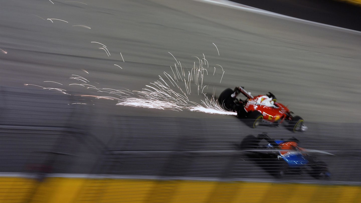 Sebastian Vettel (GER) Ferrari SF16-H and Pascal Wehrlein (GER) Manor Racing MRT05 at Formula One