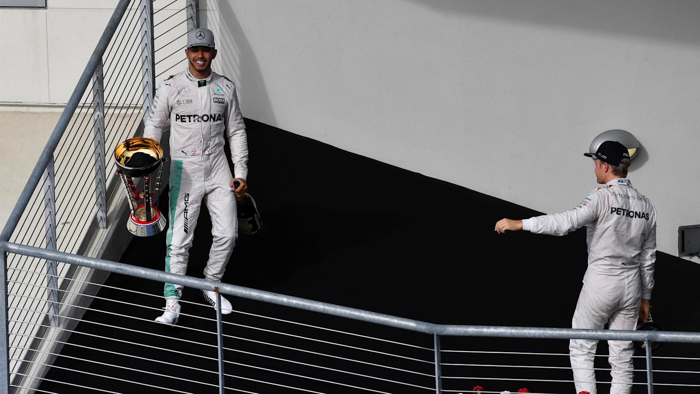 Lewis Hamilton (GBR) Mercedes AMG F1 with trophy and Nico Rosberg (GER) Mercedes AMG F1 celebrate