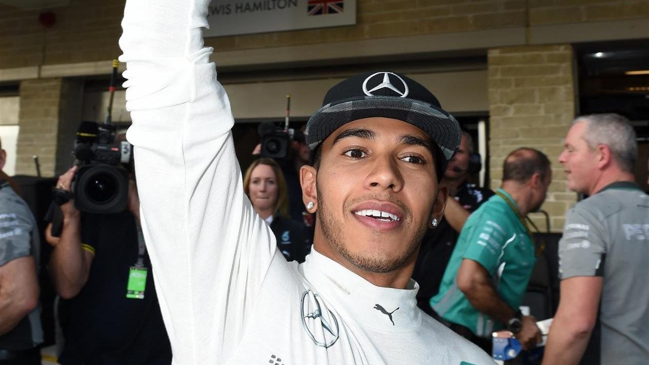 Race winner Lewis Hamilton (GBR) Mercedes AMG F1 celebrates with the trophy. Formula One World Championship, Rd17, United States Grand Prix, Race, Austin, Texas, USA, Sunday, 2 November 2014