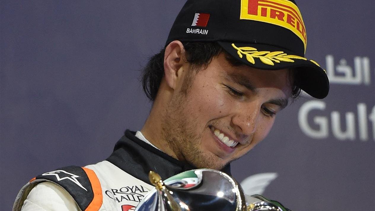 Third placed Sergio Perez (MEX) Force India with his trophy on the podium. Formula One World Championship, Rd3, Bahrain Grand Prix, Race, Bahrain International Circuit, Sakhir, Bahrain, Sunday, 6 April 201