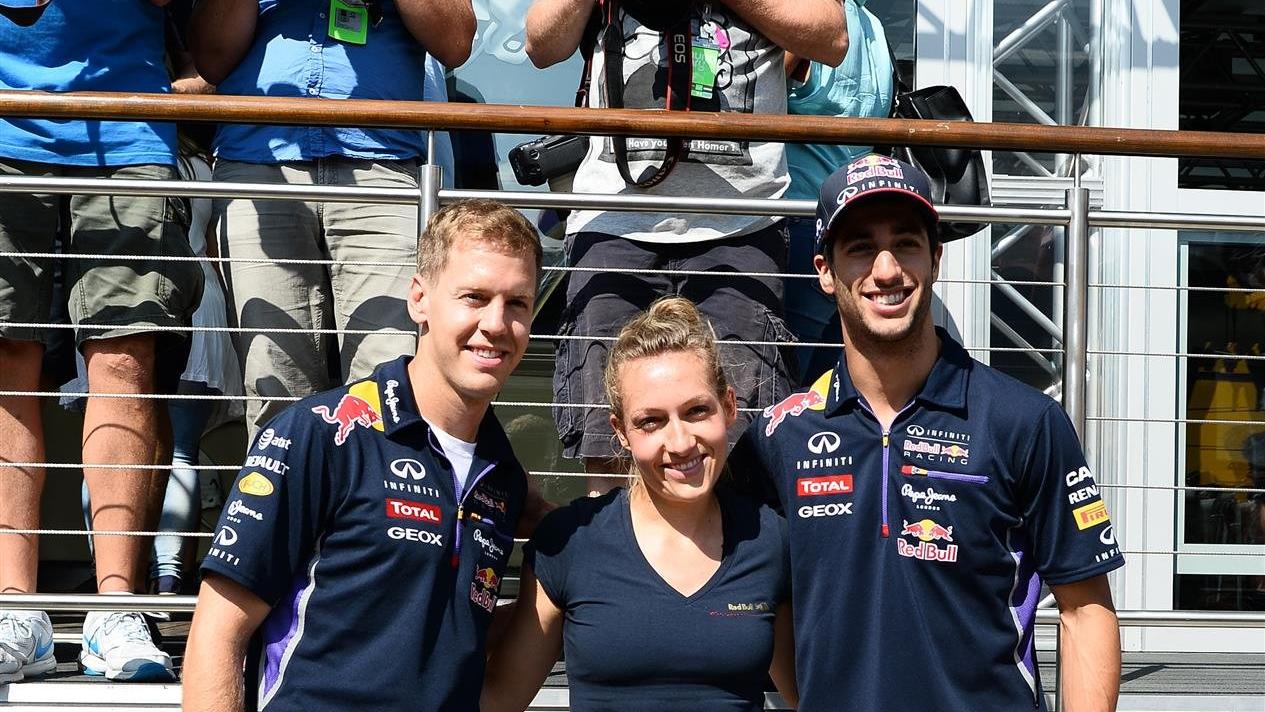 Sebastian Vettel (GER) Red Bull Racing and Daniel Ricciardo (AUS) Red Bull Racing with Red Bull Street Style footballer Kitti Szasz (HUN). Formula One World Championship, Rd11, Hungarian Grand Prix, Preparations, Hungaroring, Hungary. Thursday, 24 July 2014 © Sutton Images. No reproduction without permission