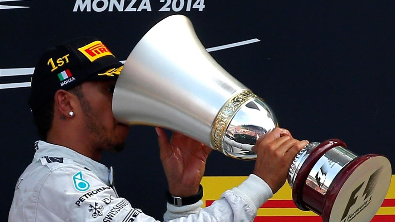 Race winner Lewis Hamilton (GBR) Mercedes AMG F1 with his trophy on the podium. Formula One World Championship, Rd13, Italian Grand Prix, Monza, Italy, Race Day, Sunday, 7 September 2014