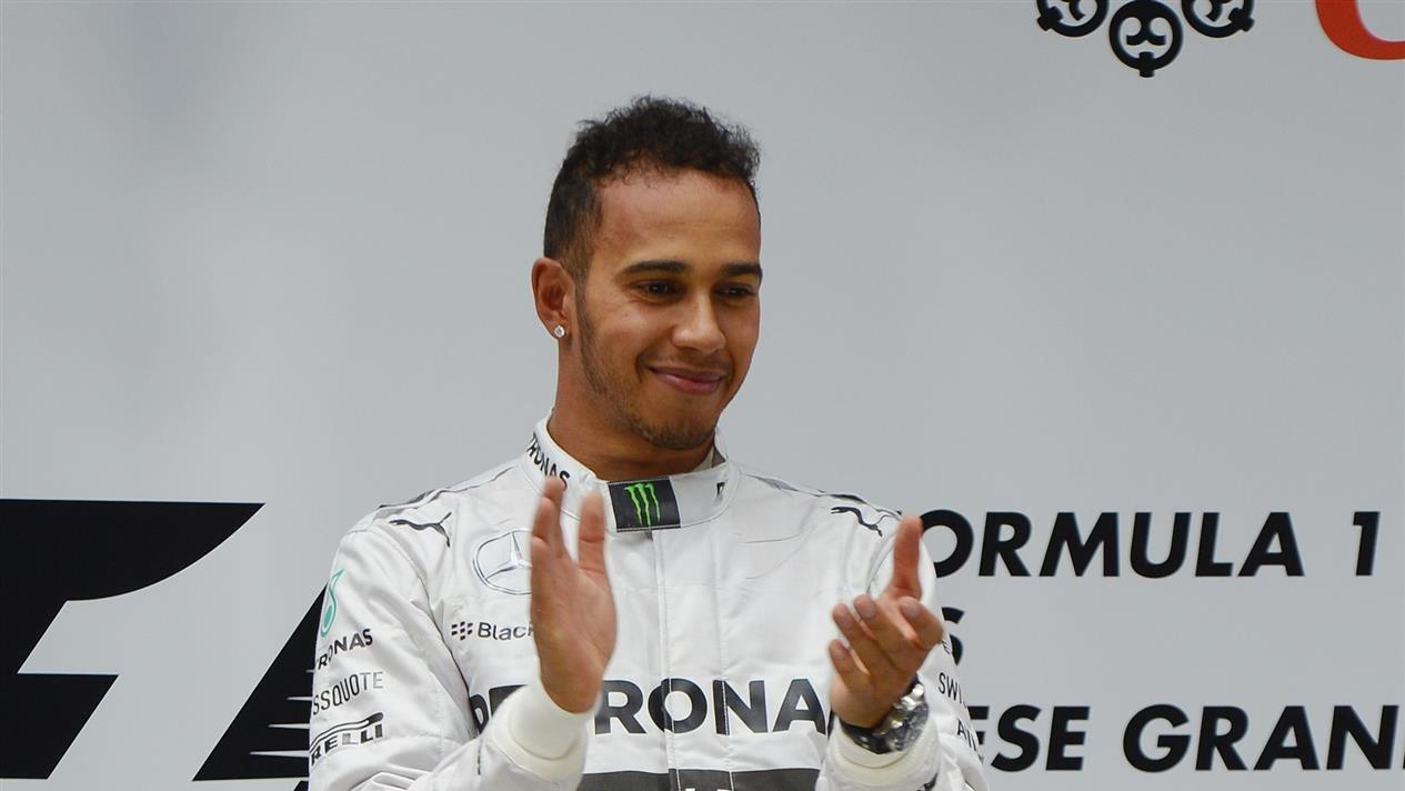 Race winner Lewis Hamilton (GBR) Mercedes AMG F1 on the podium. Formula One World Championship, Rd4, Chinese Grand Prix, Race, Shanghai, China, Sunday, 20 April 2014
