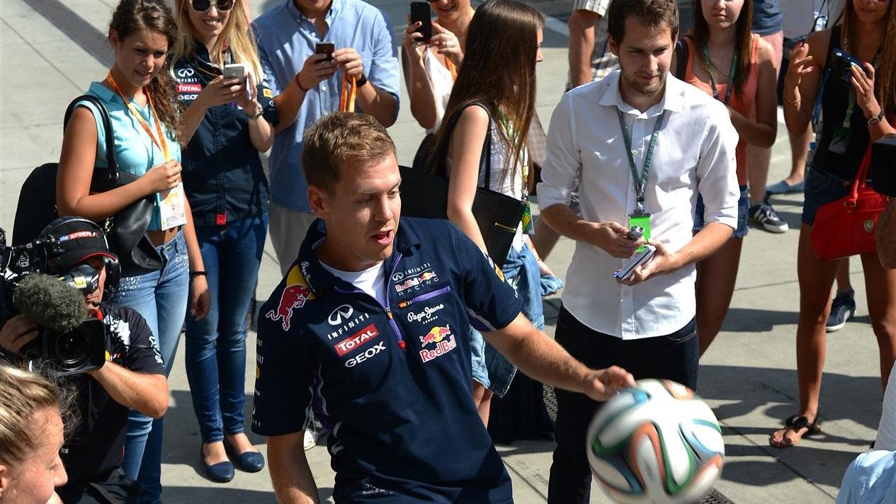 Sebastian Vettel (GER) Red Bull Racing and Daniel Ricciardo (AUS) Red Bull Racing practice their football soccer skills. Formula One World Championship, Rd11, Hungarian Grand Prix, Preparations, Hungaroring, Hungary. Thursday, 24 July 2014