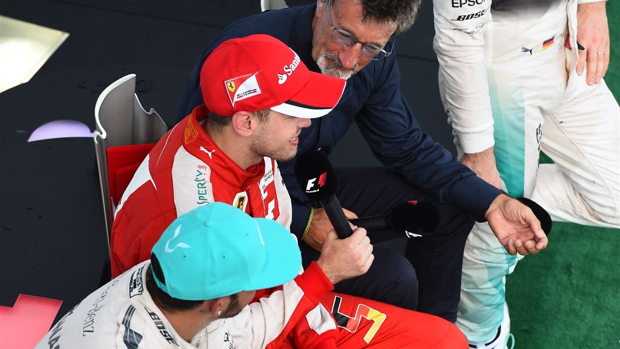 Lewis Hamilton (GBR) Mercedes AMG F1 and Sebastian Vettel (GER) Ferrari sit on the podium with Eddie Jordan (IRE) BBC Television Pundit at Formula One World Championship, Rd2, Malaysian Grand Prix, Race, Sepang, Malaysia, Sunday 29 March 2015. © Sutton Motorsport Images