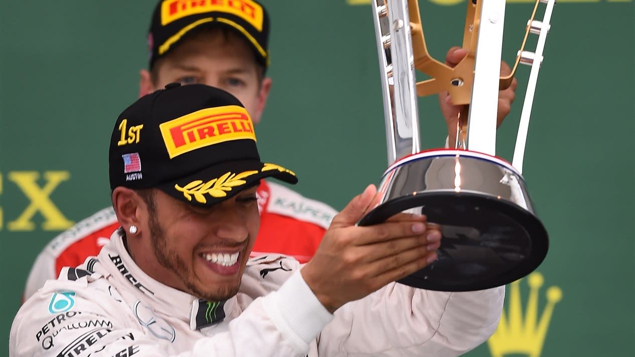 Race winner and new World Champion Lewis Hamilton (GBR) Mercedes AMG F1 celebrates on the podium with the trophy at Formula One World Championship, Rd16, United States  Grand Prix, Race, Austin, Texas, USA, Sunday 25 October 2015. © Sutton Motorsport Images