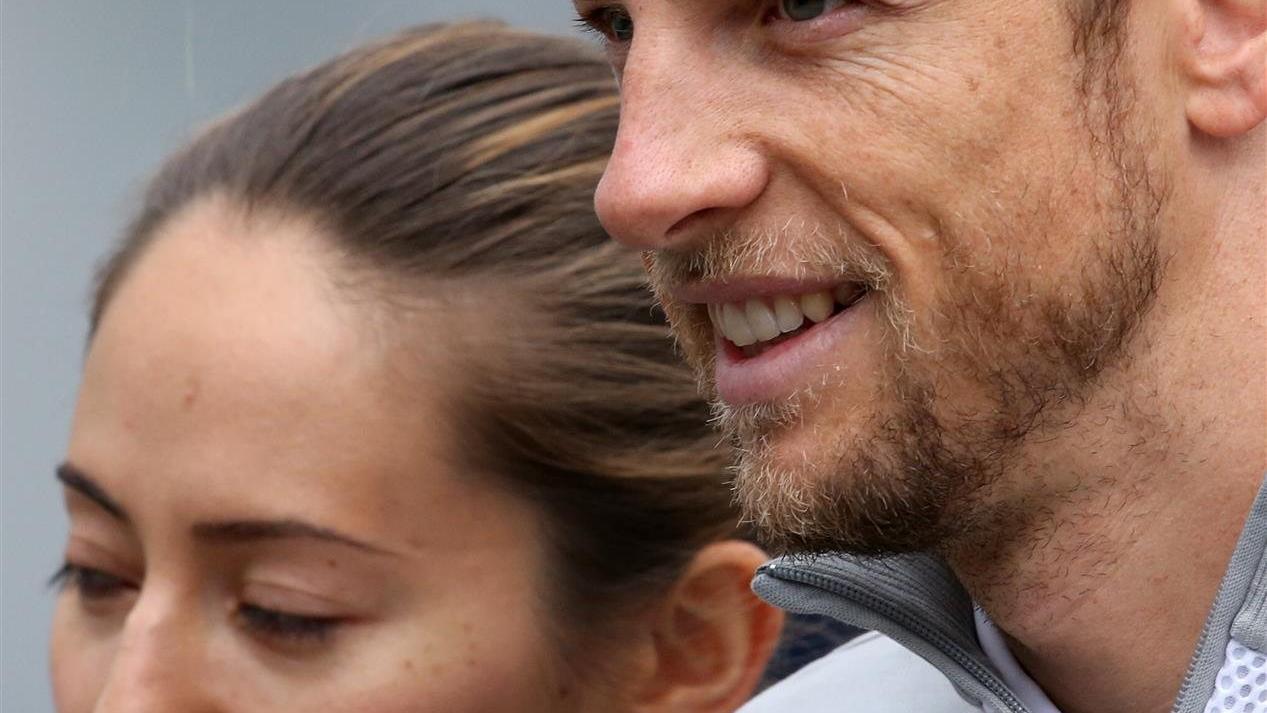 Jenson Button (GBR) McLaren and girlfriend Jessica Michibata (JPN). Formula One World Championship, Rd8, Austrian Grand Prix, Qualifying, Spielberg, Austria, Saturday, 21 June 2014. © Sutton Images
