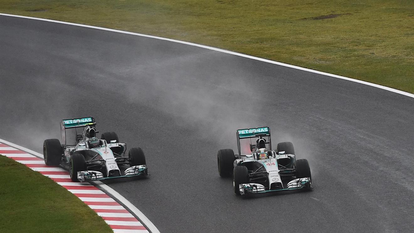 Lewis Hamilton (GBR) Mercedes AMG F1 W05 overtakes Nico Rosberg (GER) Mercedes AMG F1 W05 for the lead of the race. Formula One World Championship, Rd15, Japanese Grand Prix, Race, Suzuka, Japan, Sunday, 5 October 2014 © Sutton Images. No reproduction without permission