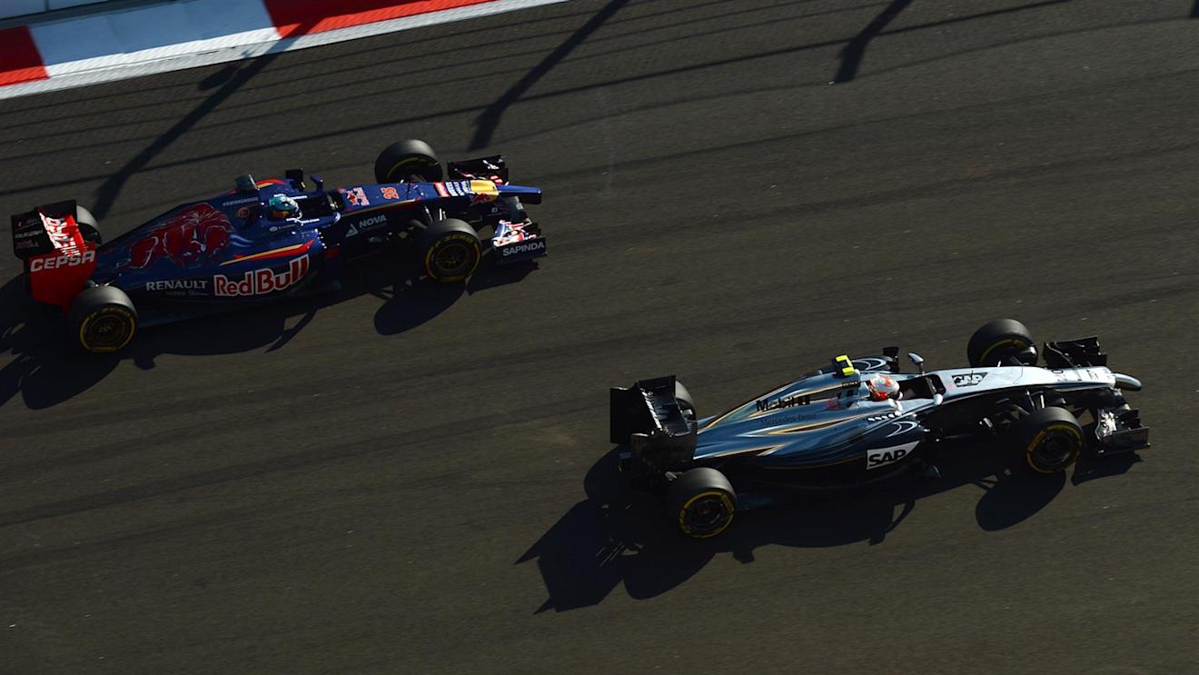Kevin Magnussen (DEN) McLaren MP4-29 and Jean-Eric Vergne (FRA) Scuderia Toro Rosso STR9. Formula One World Championship, Rd16, Russian Grand Prix, Race, Sochi Autodrom, Sochi, Krasnodar Krai, Russia, Sunday, 12 October 2014 © Sutton Images. No reproduction without permission