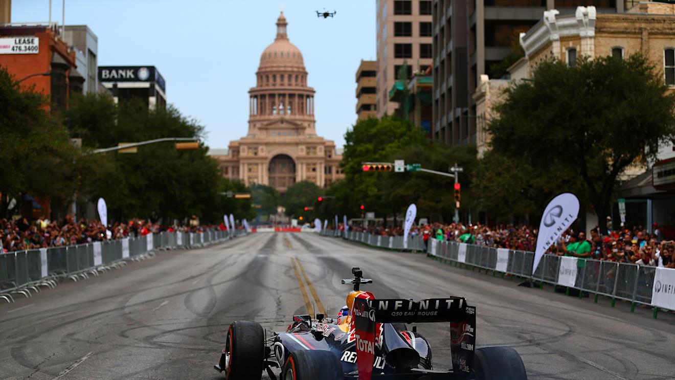 AUSTIN, TX - OCTOBER 29: Sebastian Vettel of Germany and Infiniti Red Bull Racing drives along North Congress Avenue backdropped by the Texas Capitol building during previews ahead of the United States Formula One Grand Prix on the streets of Austin on October 29, 2014 in Austin, United States. © Dan Istitene/Getty Images/Red Bull
