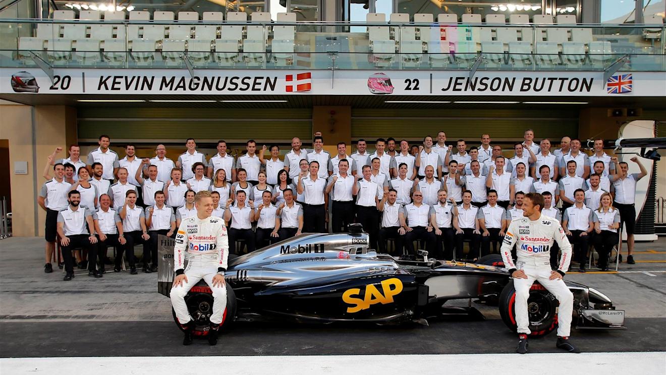 Kevin Magnussen (DEN) McLaren and Jenson Button (GBR) McLaren at the McLaren Team Photo. Formula One World Championship, Rd19, Abu Dhabi Grand Prix, Preparations, Yas Marina Circuit, Abu Dhabi, UAE, Thursday, 20 November 2014 