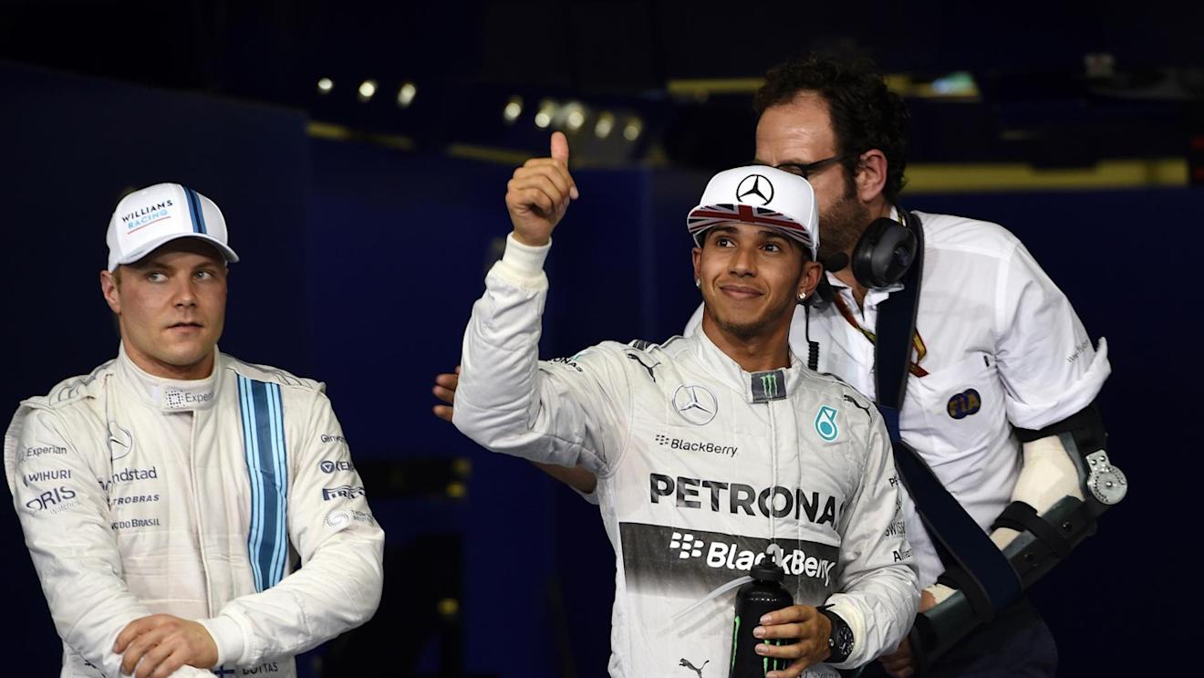 Lewis Hamilton (GBR) Mercedes AMG F1 celebrates his second place in qualifying in parc ferme. Valtteri Bottas (FIN) Williams Martini Racing, left, was third. Formula One World Championship, Rd19, Abu Dhabi Grand Prix, Qualifying, Yas Marina Circuit, Abu Dhabi, UAE, Saturday, 22 November 2014 