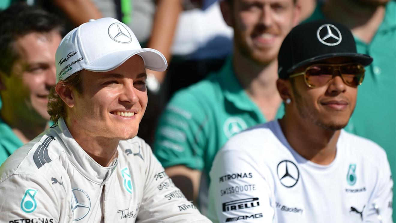 Nico Rosberg (GER) Mercedes AMG F1 celebrates with Lewis Hamilton (GBR) Mercedes AMG F1 and the team. Formula One World Championship, Rd18, Brazilian Grand Prix, Qualifying, Sao Paulo, Brazil, Sunday, 9 November 2014 