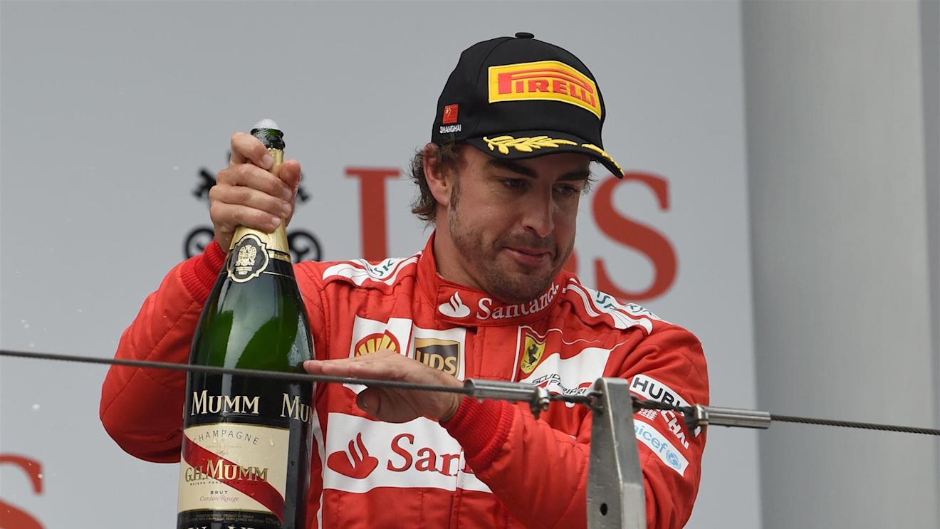 Third placed Fernando Alonso (ESP) Ferrari celebrates on the podium with the champagne. Formula One World Championship, Rd4, Chinese Grand Prix, Race, Shanghai, China, Sunday, 20 April 2014